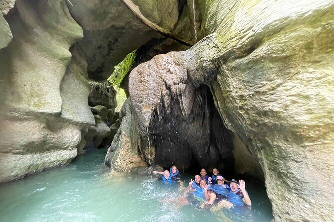 Arenales River Caving, Waterfall &Tropical Forest Secret Spring - Stop 1 (Vega Baja): river trail, cave swim, and the adrenaline moment